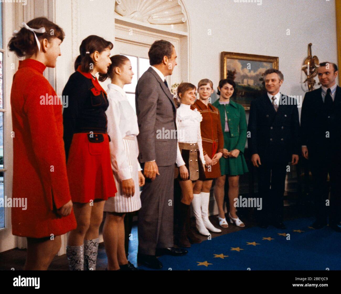 President Richard Nixon Standing in the Oval Office with Members of the Russian Soviet Women's Gymnastics Team, Olympic Gold Medalist Olga Korbut Stands next to Richard Nixon 3 21 1973 Stock Photo