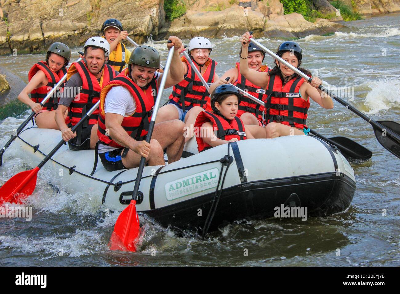 Mygiya / Ukraine - June 26 2018: Young person rafting on the river, extreme and fun sport at tourist attraction. Rafting on the  Pivdennyi Buh River Stock Photo