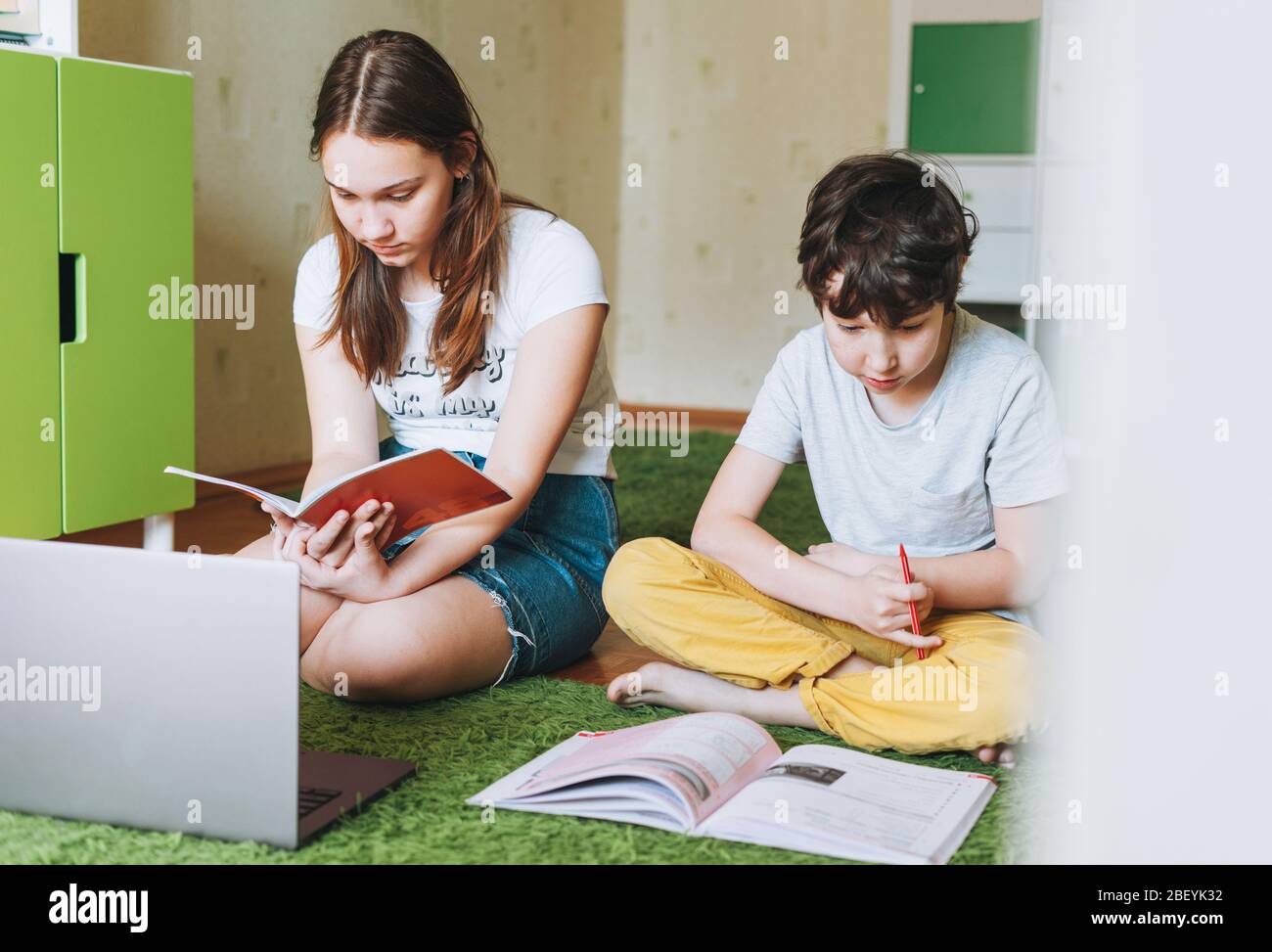 Siblings Writing Siblings brother sister attractive girl teenager and tween boy do ...