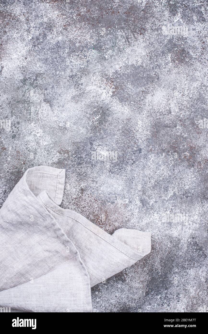 Linen napkin or towel on grey kitchen table Stock Photo
