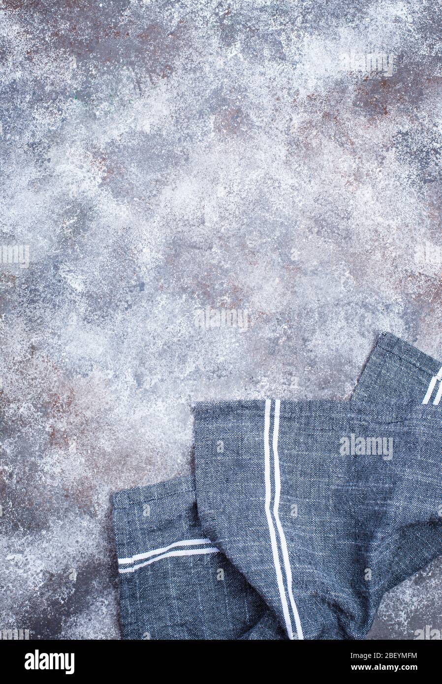 Linen napkin or towel on grey kitchen table Stock Photo