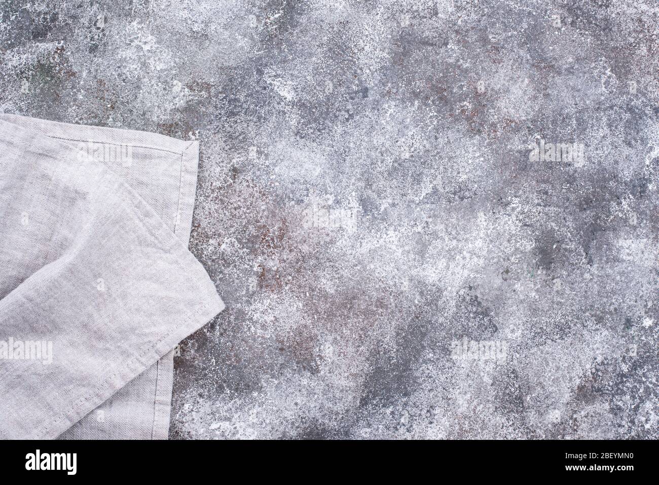 Linen napkin or towel on grey kitchen table Stock Photo