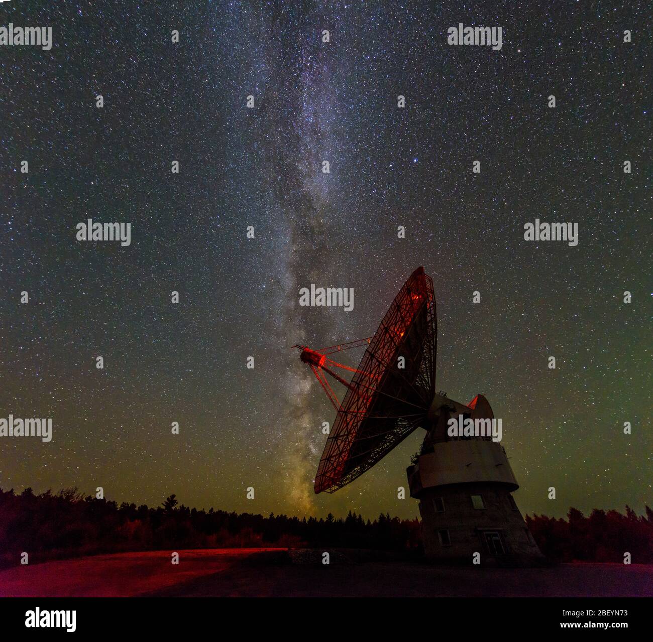 Night sky and the Radio telescope dish at Algonquin Radio Observatory