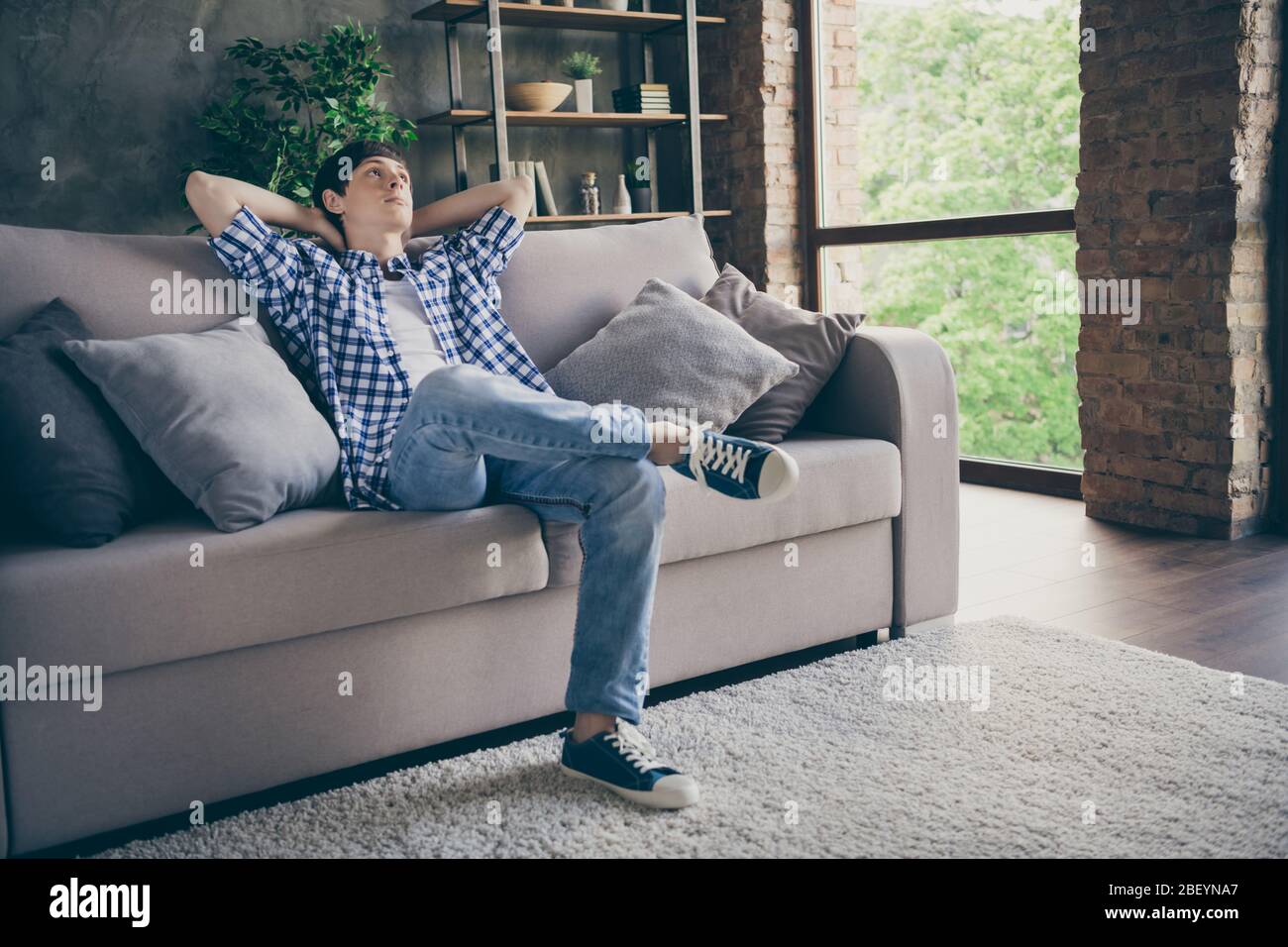 Teen boy relaxing sofa hi-res stock photography and images - Alamy
