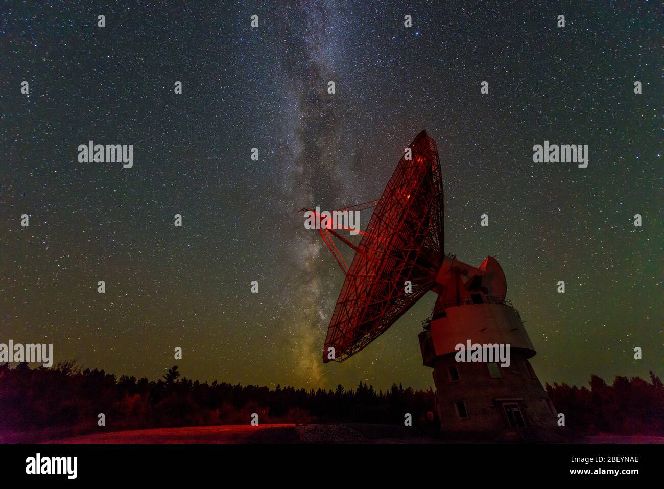 Night sky and the Radio telescope dish at Algonquin Radio Observatory