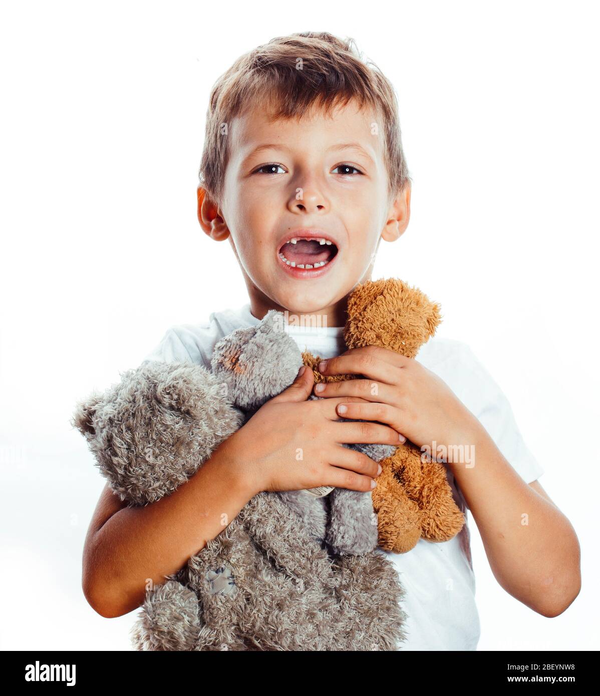 little cute boy with many teddy bears hugging isolated on white ...