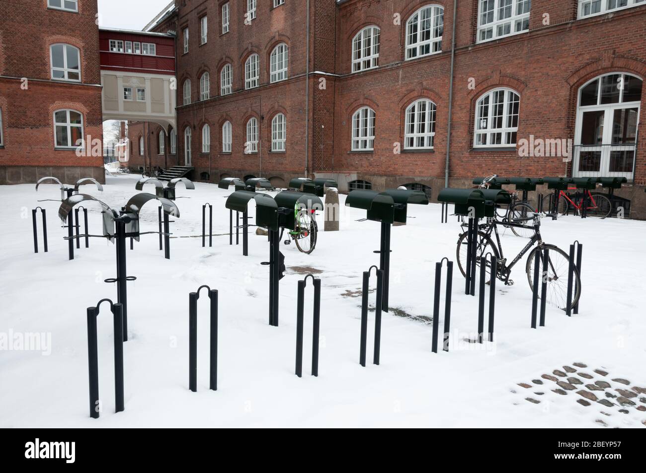 Copenhagen, Denmark - February 23, 2010: It is a bicycle parking with snow and water seat protection in Copenhagen. Stock Photo