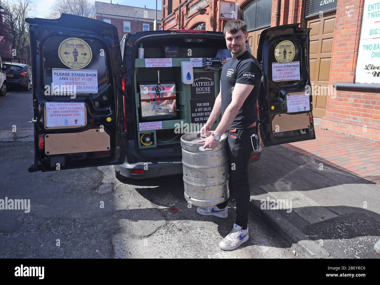 Bar Manager Richard Keenan loads a keg into his mobile beer delivery