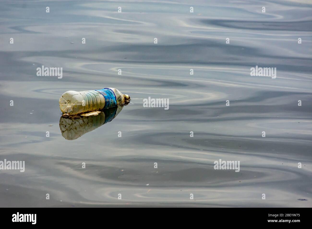 plastic trash garbage on the bay walk polluting the ocean and