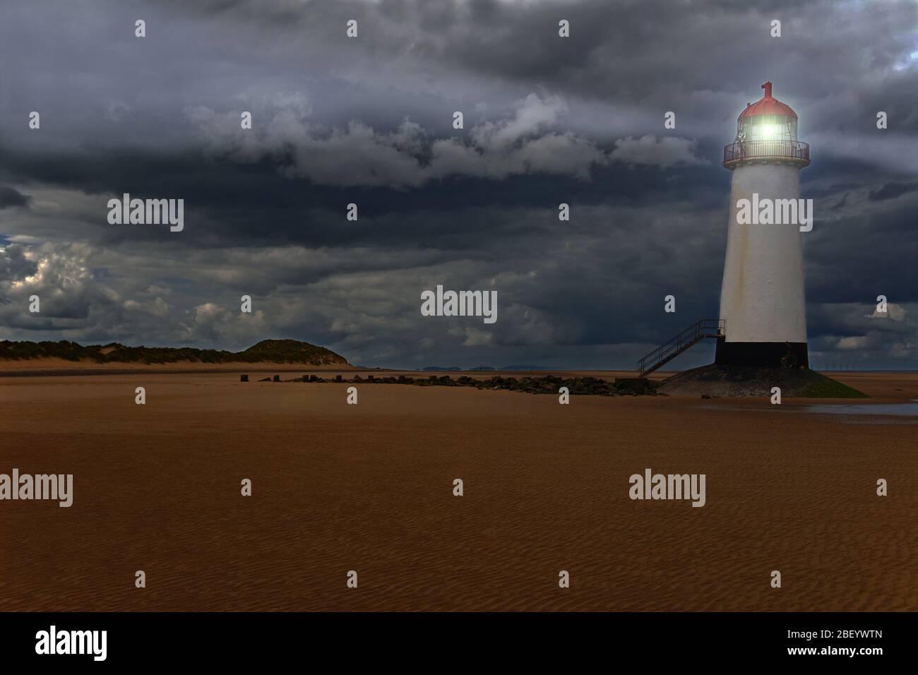 Point of Ayr Lighthouse stands at the mouth of the Dee Estuary, Wales. Built in 1776 it has been brought back to life with the magic of Photoshop. Stock Photo