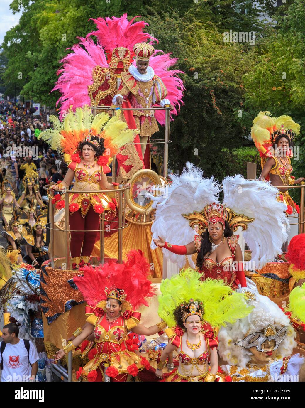 Colourful Caribbean float and participants in costume at Notting Hill carnival street festival and parade, London, UK Stock Photo
