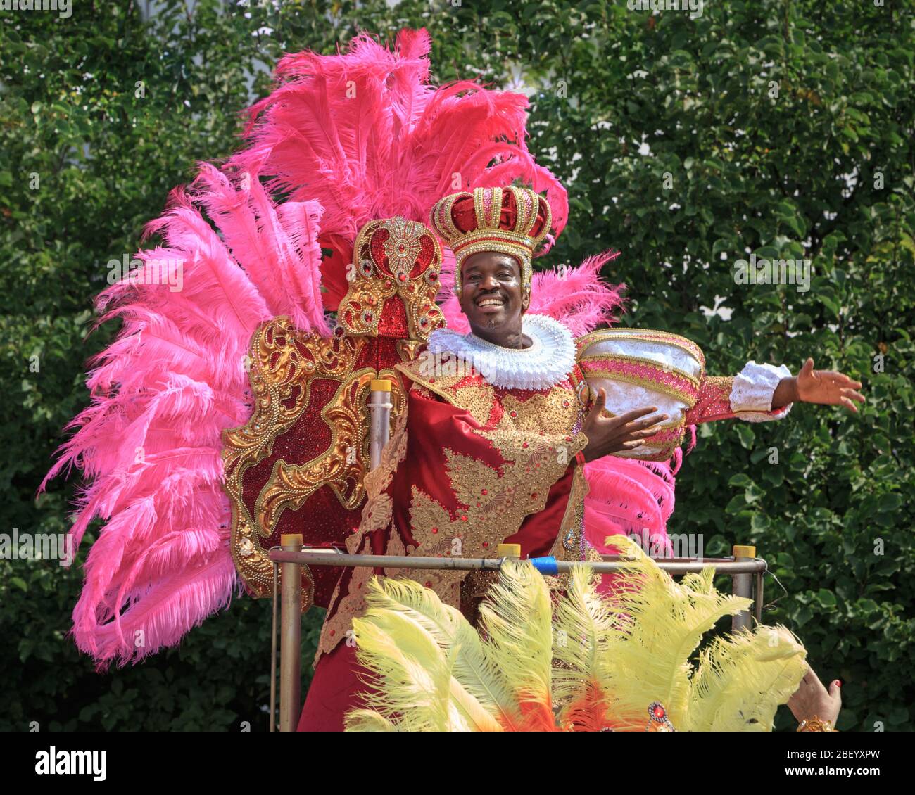 Carnival King, Caribbean float and participants in costume at Notting