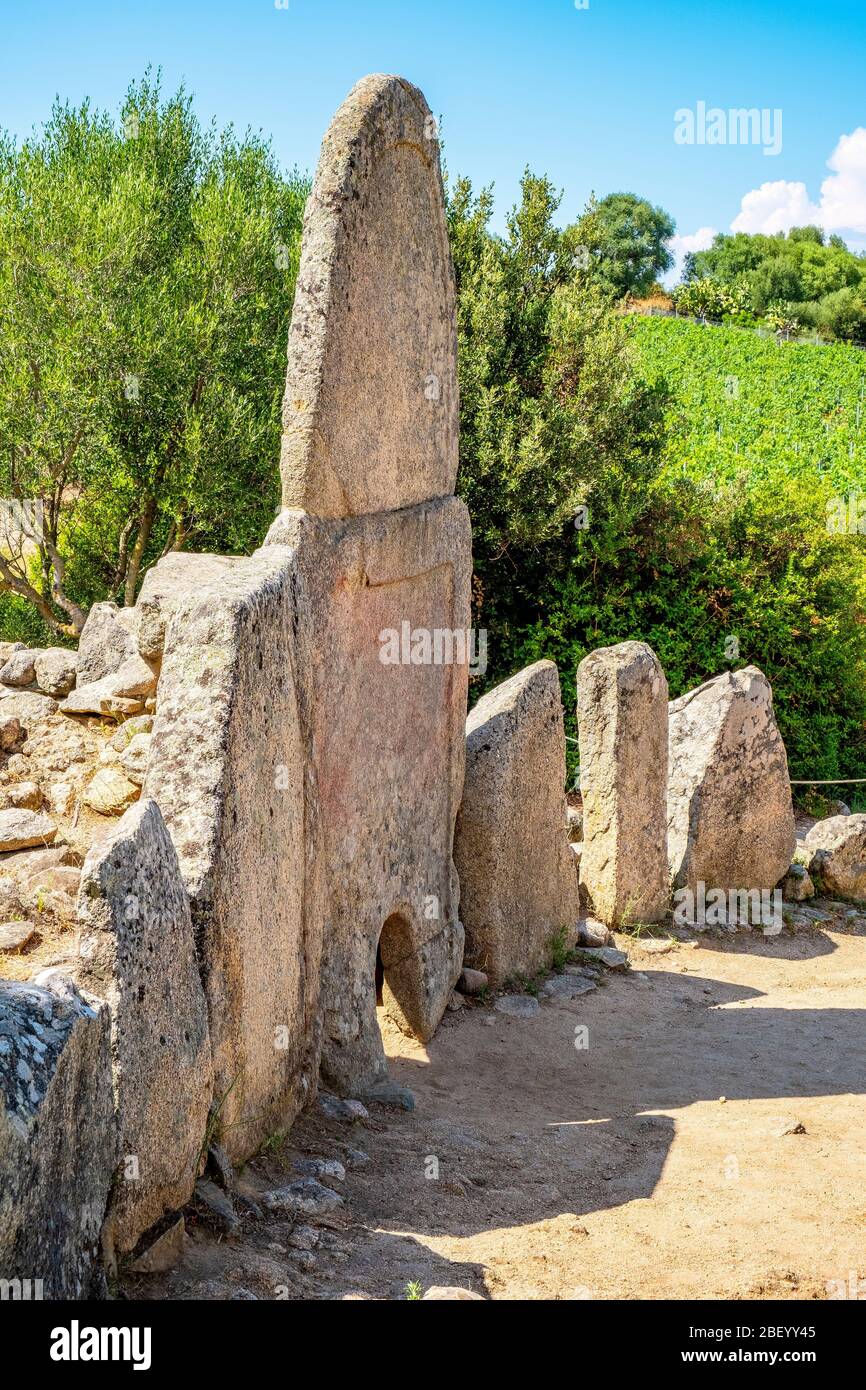 Arzachena, Sardinia / Italy - 2019/07/19: Archeological ruins of Nuragic necropolis Giants Tomb of Coddu Vecchiu  - Tomba di Giganti Coddu Vecchiu - w Stock Photo