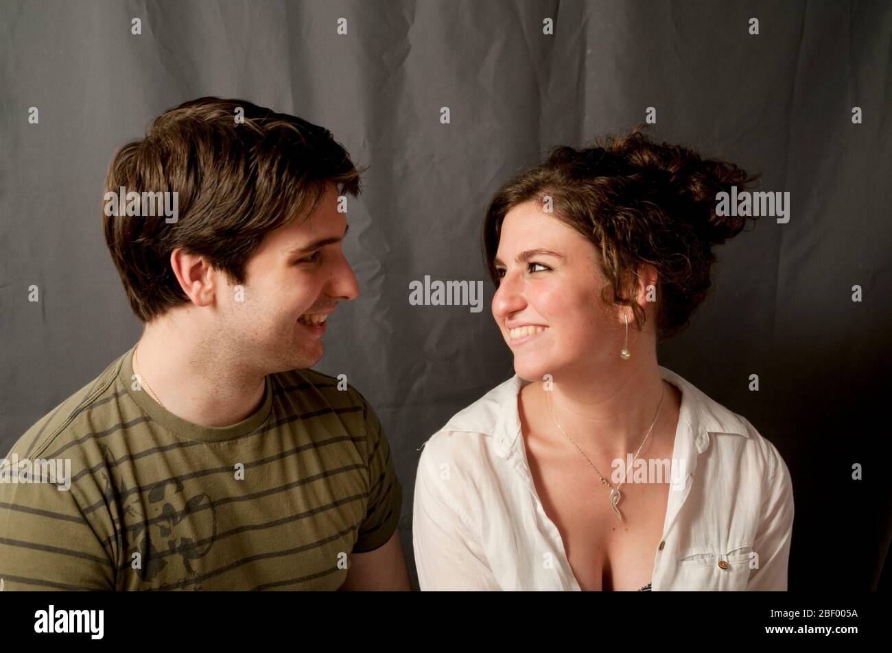 Young couple smiling and looking at each other. Stock Photo