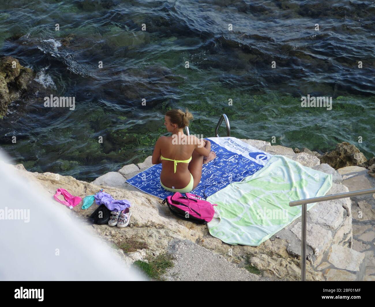 On the beach of Rovinj there are places to have  privacy and enjoy  the Adriatic Sea Stock Photo