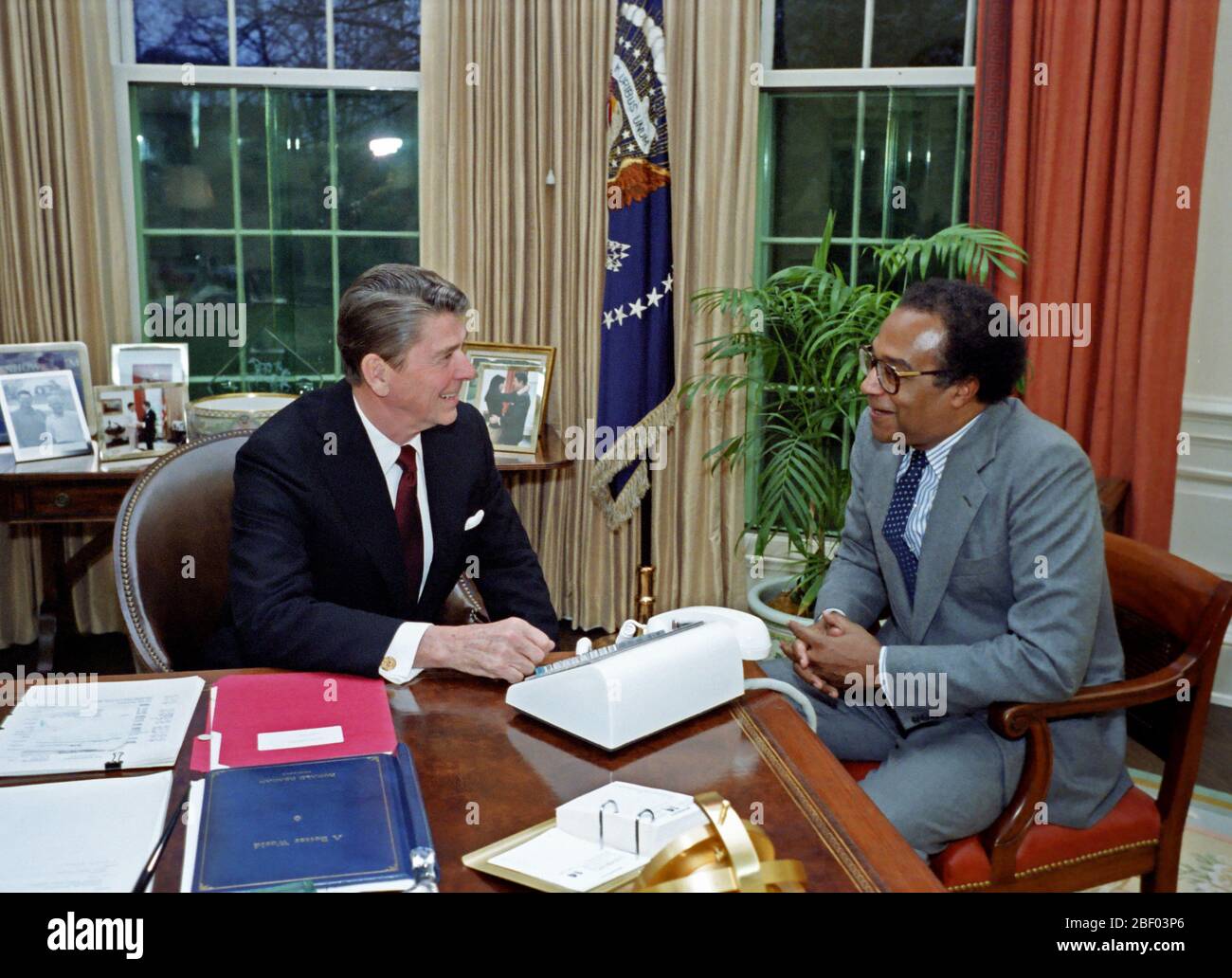 12/14/1981 President Reagan with Samuel Pierce Jr in the Oval Office Stock Photo