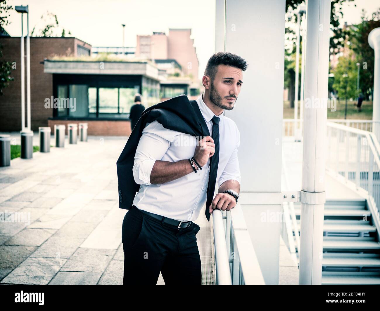 Stylish handsome young man wearing business suit Stock Photo - Alamy