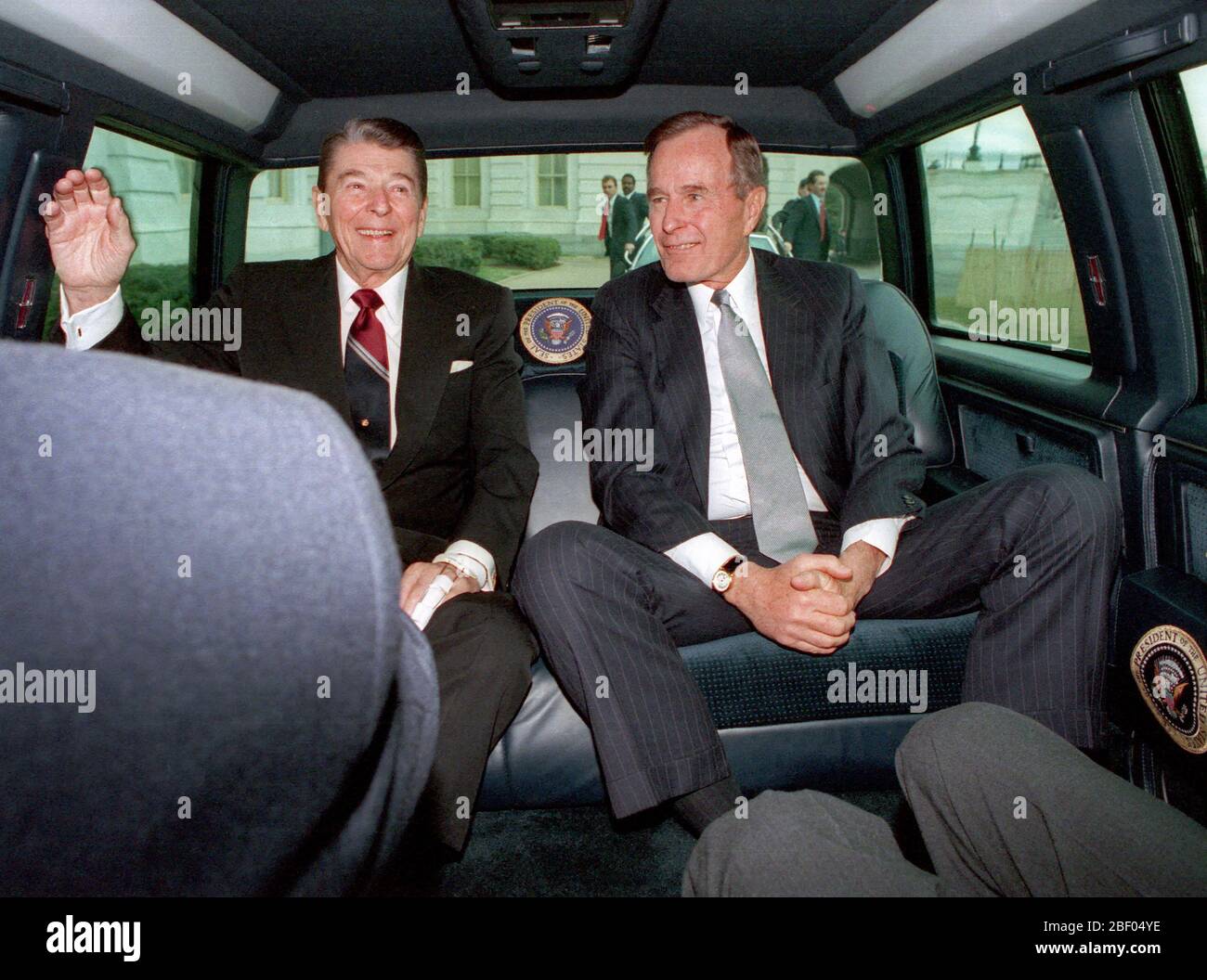 1/20/1989 President Reagan and George Bush traveling via limousine to the United States Capitol Stock Photo