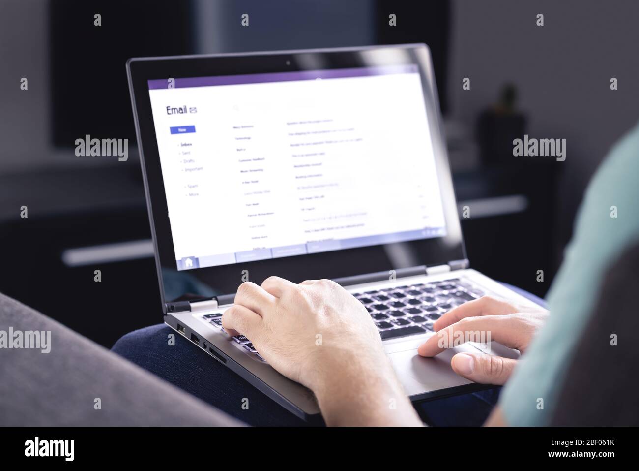 Email inbox on laptop screen. List of messages. Man checking received e mail. Spam, junk and digital marketing. Read, reply or forward posts. Stock Photo
