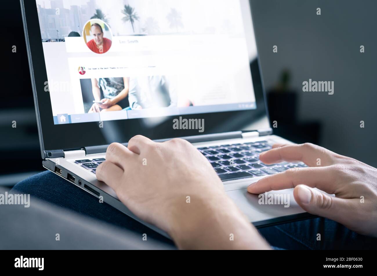 Social media website. Networking site in laptop screen with profile photo, shared posts and status updates. Personal branding concept. Stock Photo
