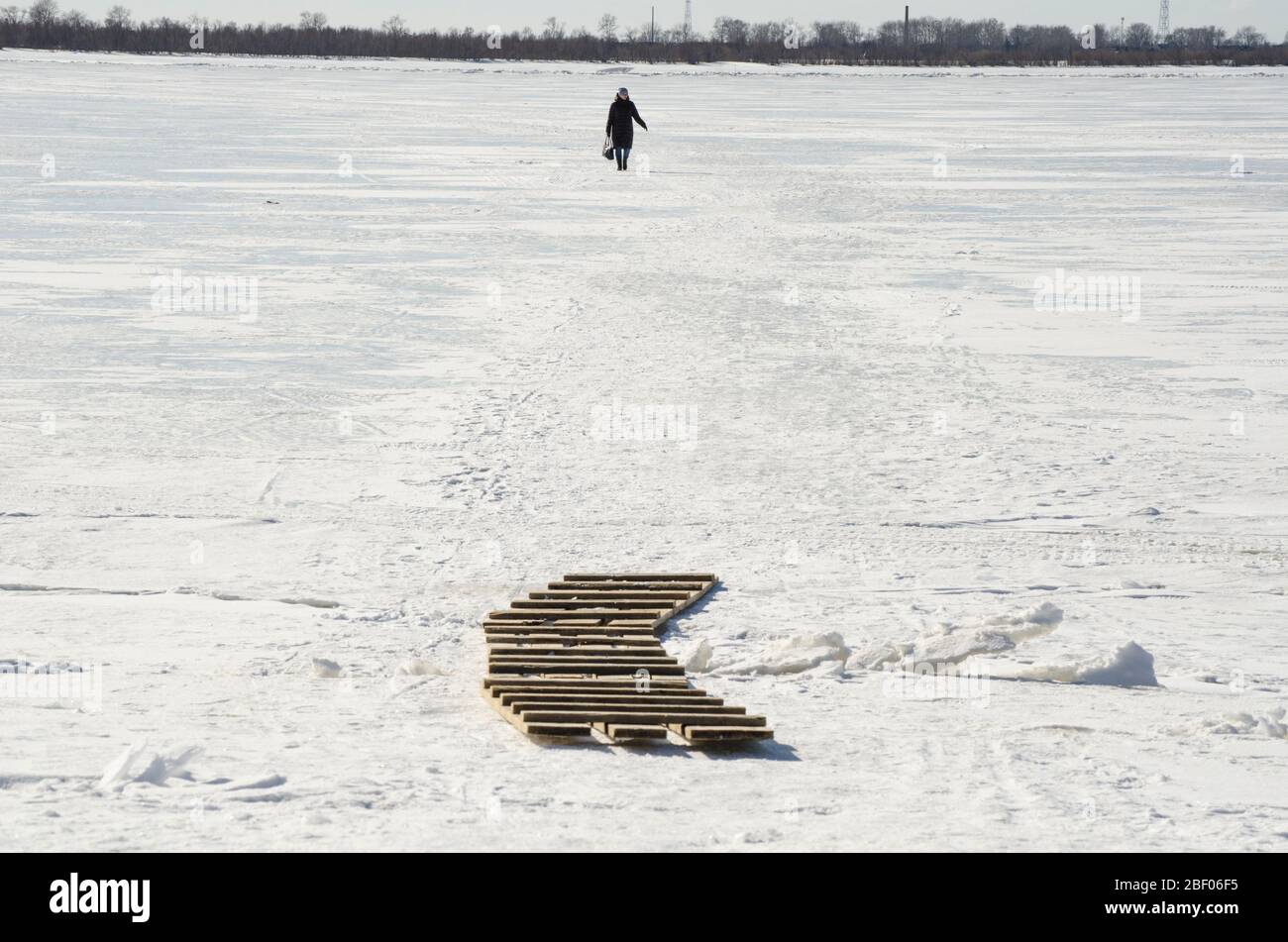 Trail on the ice. Pedestrian crossing the river Stock Photo