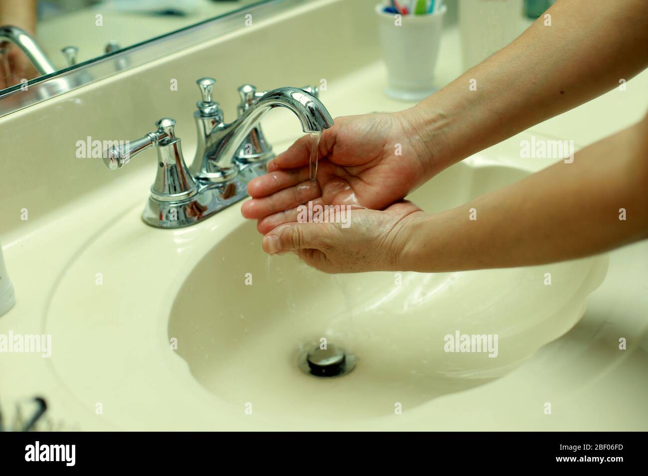 sanitizing your hands, washing hands, clean and sanitized, Stock Photo