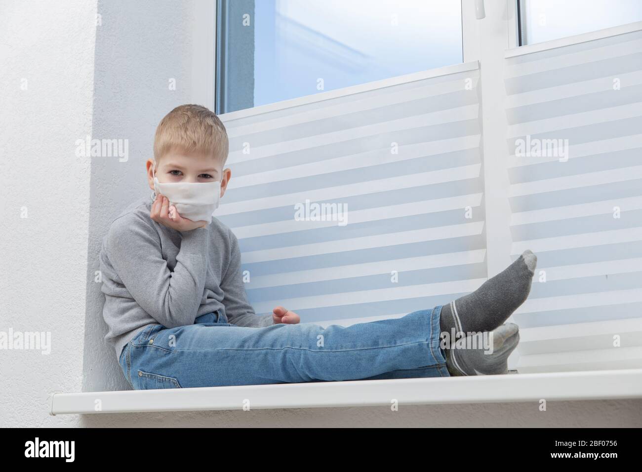 Boy wearing medical face mask hi-res stock photography and images - Alamy