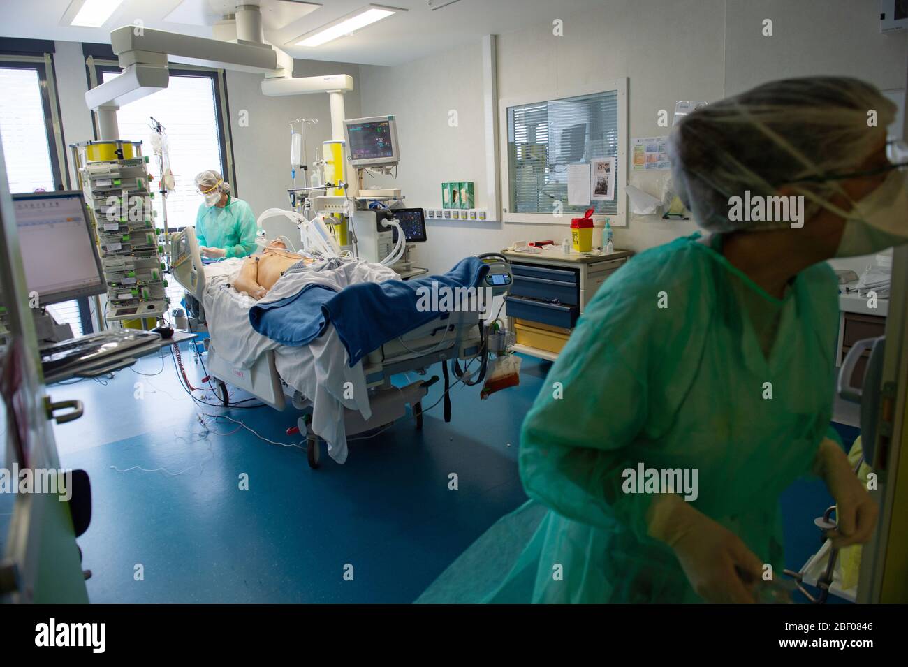 Hospital in La Roche-sur-Yon (western France) on April 6, 2020: medical staff in the ICU taking care of patients affected by Covid19. Restriction: cor Stock Photo
