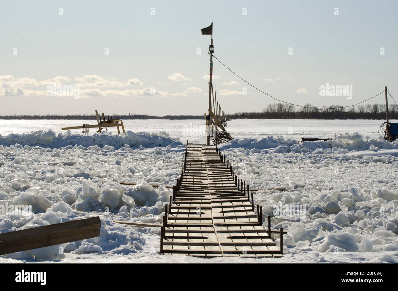 Trail on the ice. Pedestrian crossing the river Stock Photo