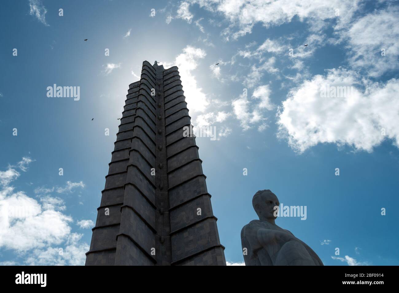 Urban wildlife: Looking up the José Martí Memorial tower with turkey vultures (Cathartes aura) circling the op of the monument, Havana, Cuba Stock Photo