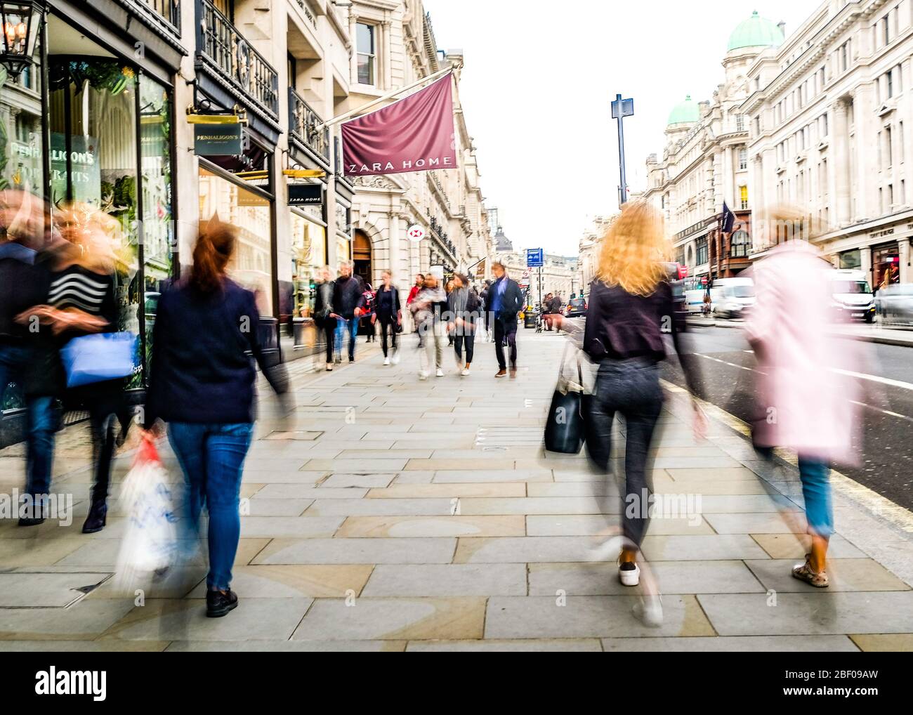 LONDON- Crowds of motion blurred shoppers on Regent Street, a landmark street in the West End Stock Photo