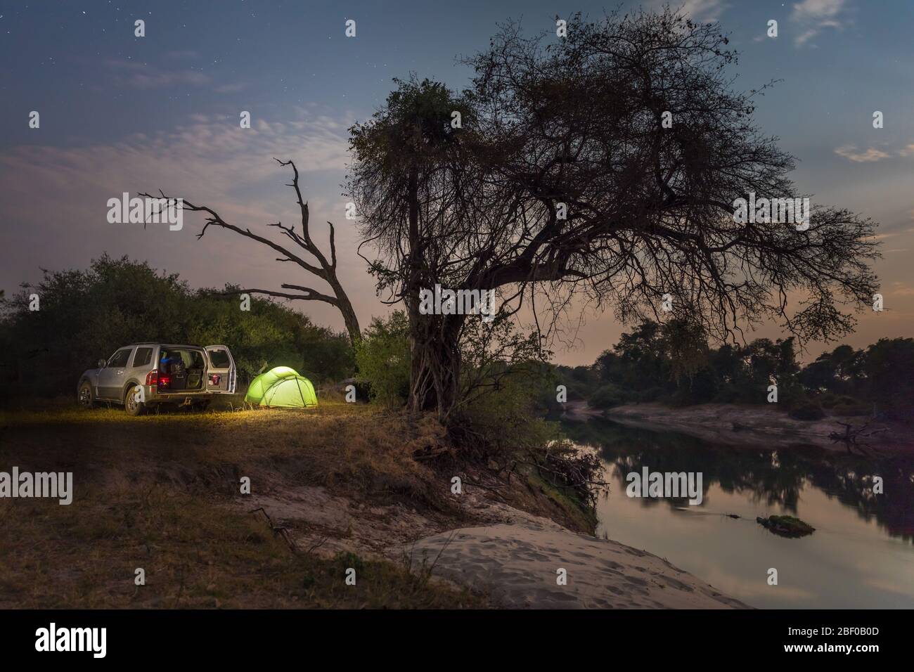 Zambezi National Park, Matabeleland North Province, Zimbabwe offers camping on the banks of the mighty Zambezi River. Stock Photo