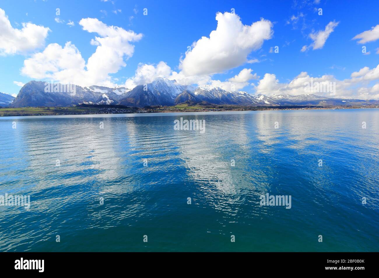 View of Bernese Alps from Oberhofen, located on the northern shore of Lake Thun. Switzerland, Europe. Stock Photo
