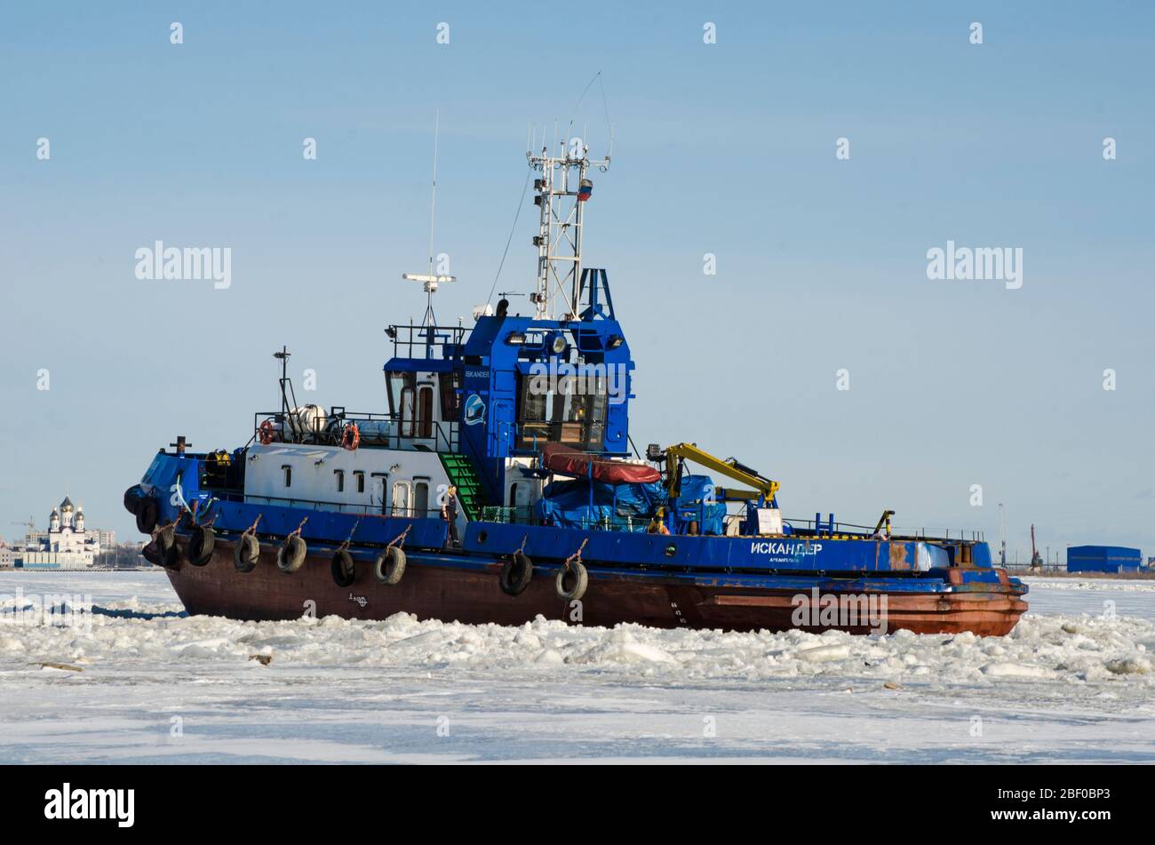 Tugboats work on the river. Spring navigation Stock Photo - Alamy