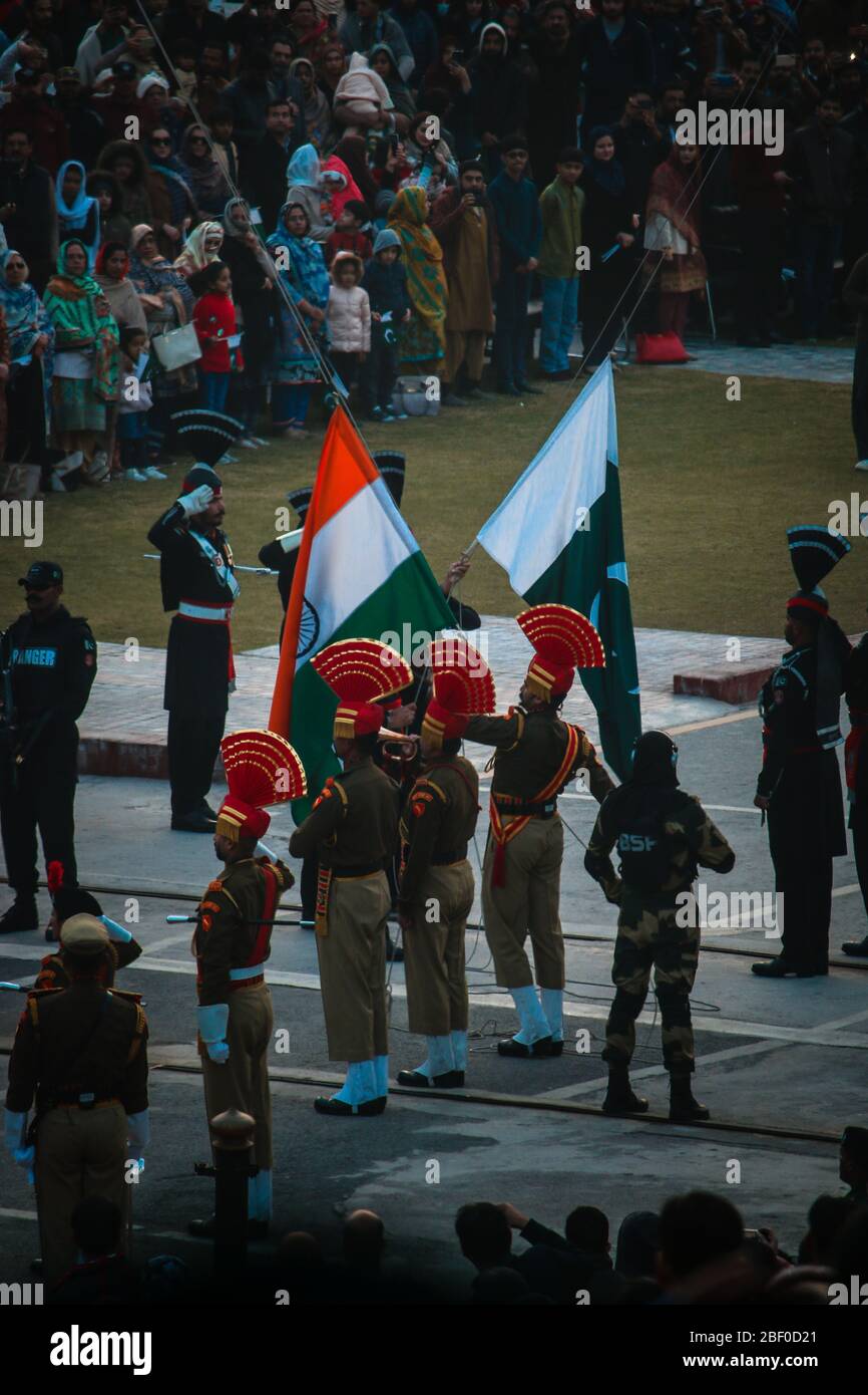 Indian Army & Pakistan Army changing flags at Wagha Border, Amritsar. Stock Photo