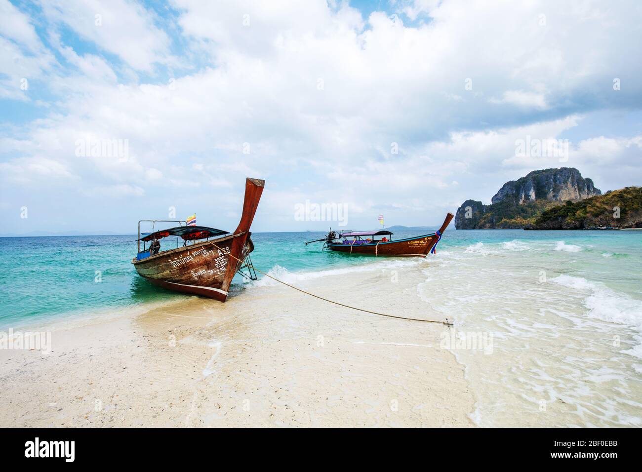 Longtail boat in Tup Island with clear blue waters. Krabi province. Ao Nang, Thailand. Stock Photo