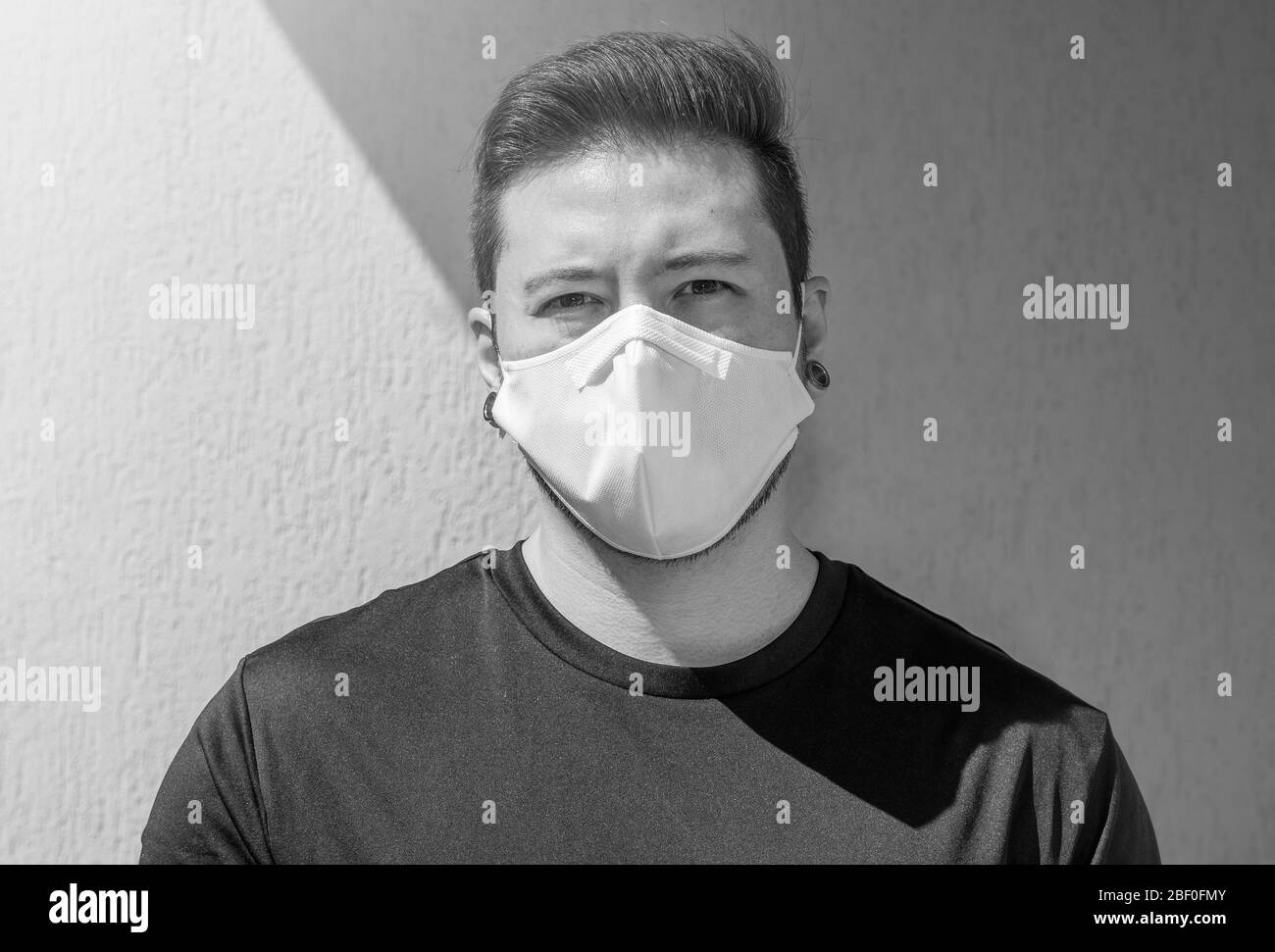 Wearing a white face mask hi-res stock photography and images - Alamy