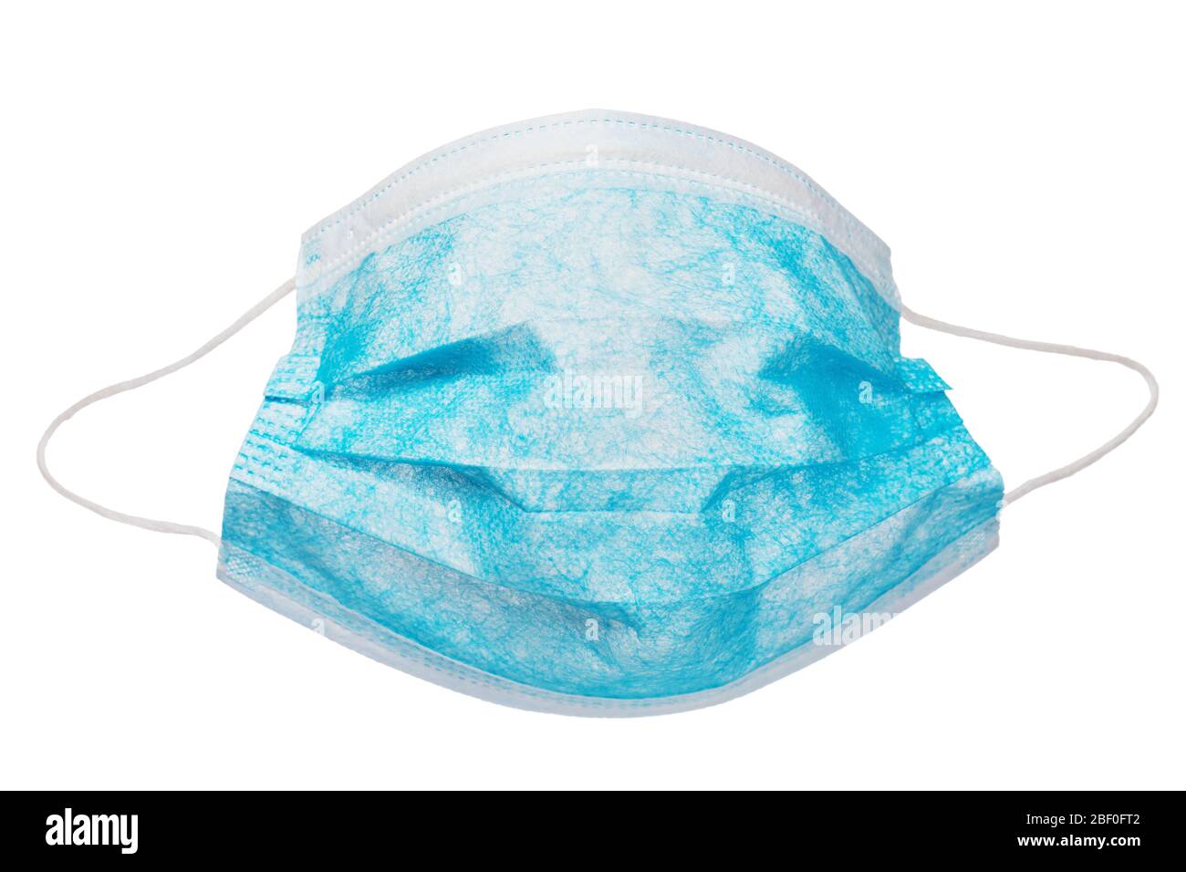 Blue medical mask isolated on white background. Protection against coronavirus and other respiratory viruses Stock Photo