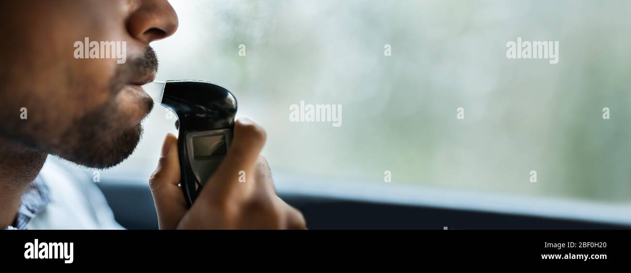 Breathalyzer Alcohol Test In Car. Man Taking Breath Test Stock Photo Alamy
