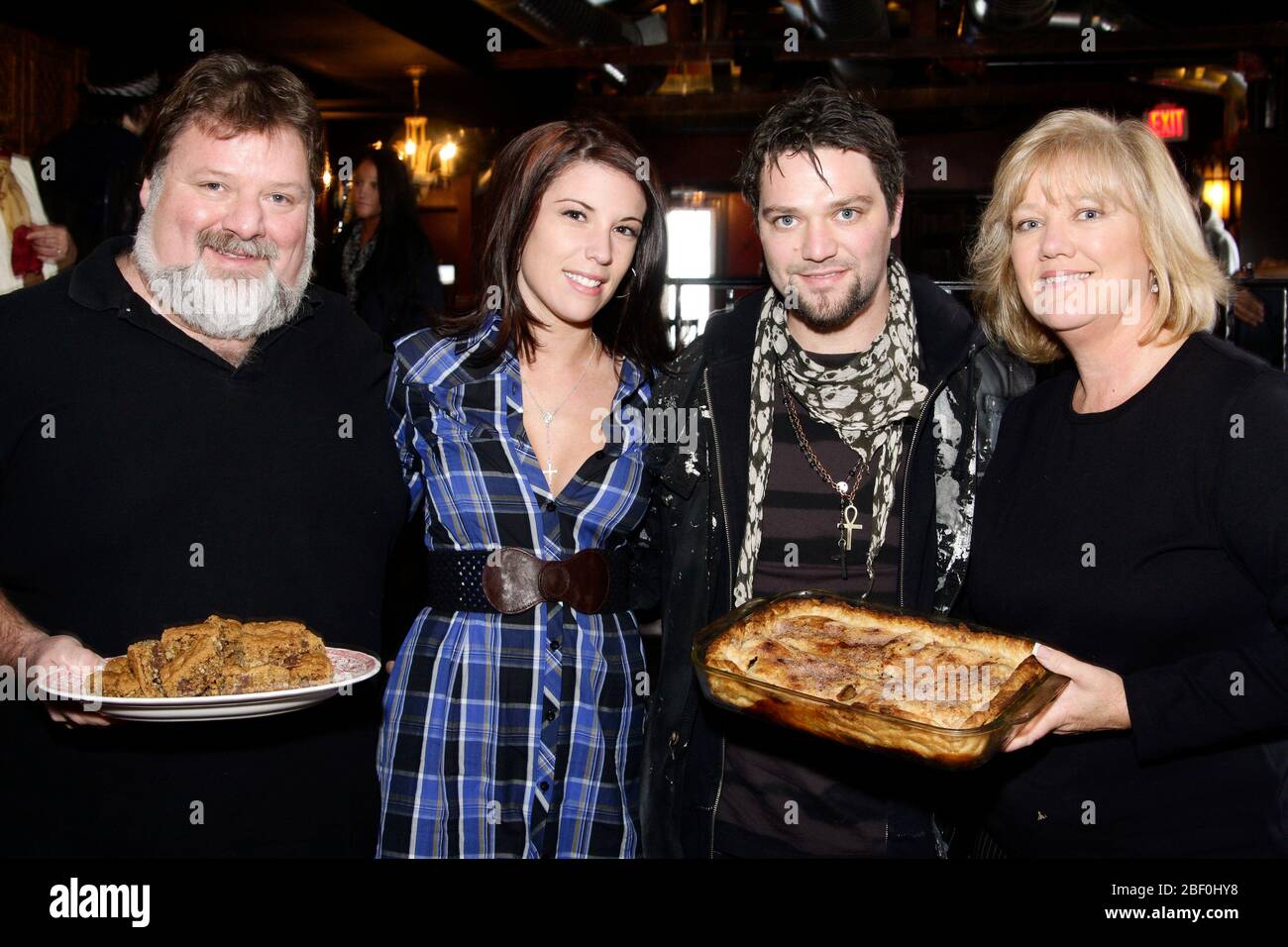 Bam Margera pictured with his wife, Missy and his mom and dad, April and Phil, with homemade deserts at The Note, Bam's new club in West Chester, PA on November 18, 2008. Credit: Scott Weiner/MediaPunch Stock Photo