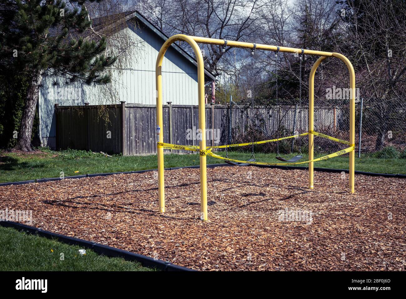 Roped Off Swings And Playground Closure During Coronavirus COVID 19 Global Pandemic Stock Photo 