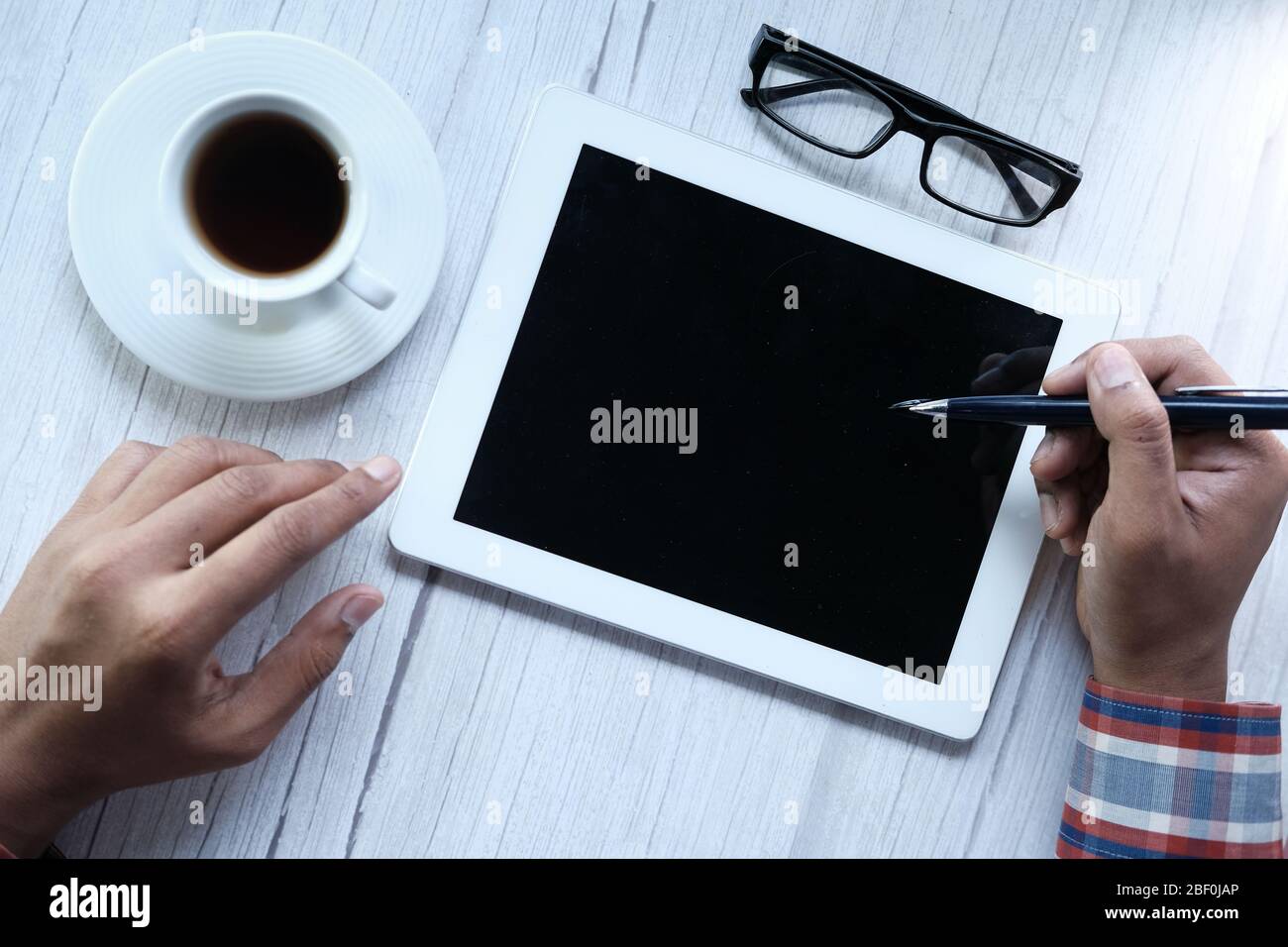 young man using digital tablet on table  Stock Photo