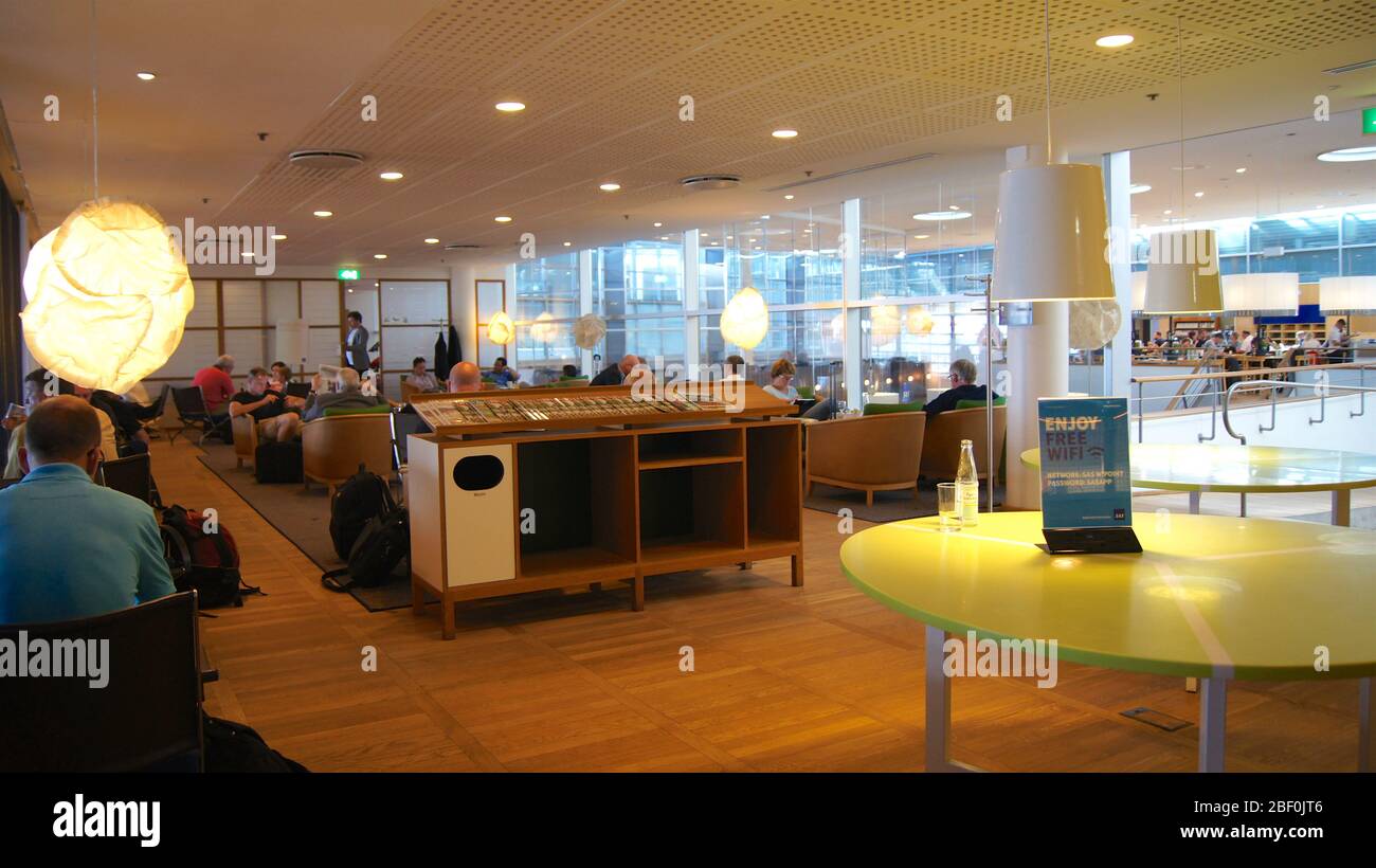 COPENHAGEN, DENMARK - JUL 06th, 2015: Airport interior inside a business lounge with seating area and drinks Stock Photo