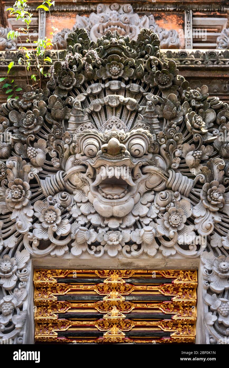 Vertical close up of a Bhoma sculpture at Ubud palace in Bali, Indonesia. Stock Photo