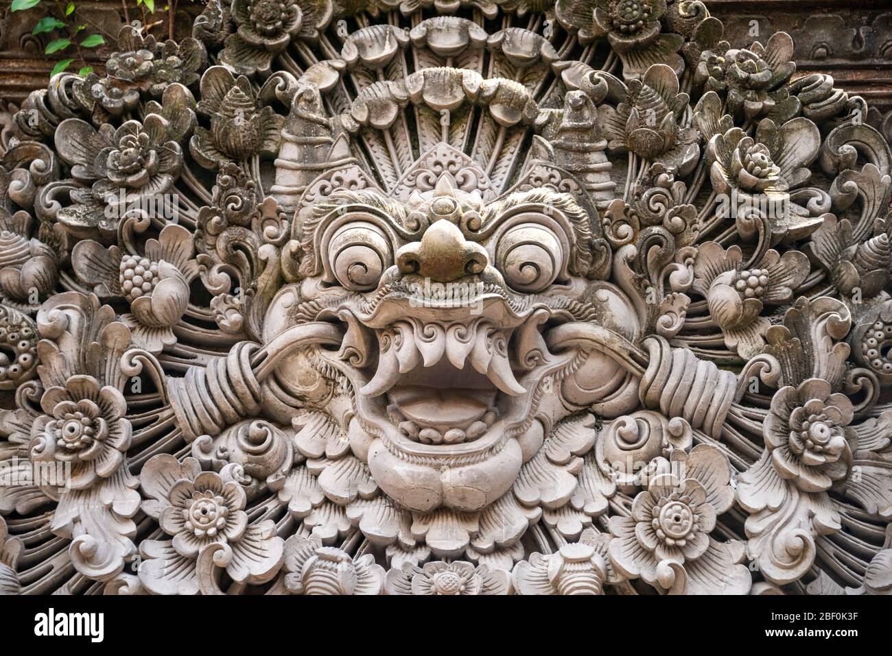 Horizontal close up of a Bhoma sculpture at Ubud palace in Bali, Indonesia. Stock Photo