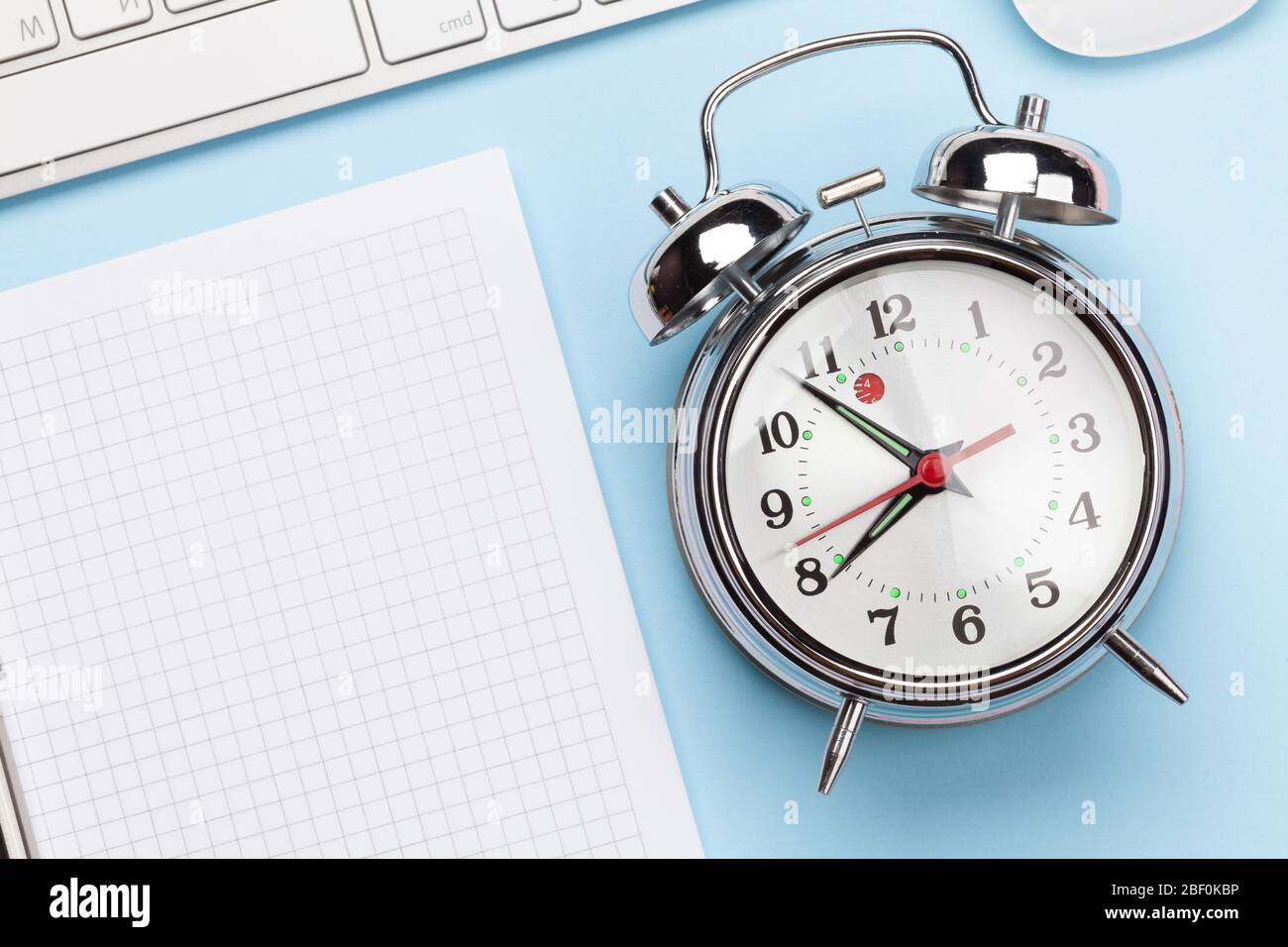 Blue workplace desk table with computer, supplies and alarm clock. Morning  or deadline concept. Top view with space for your text. Flat lay Stock  Photo - Alamy
