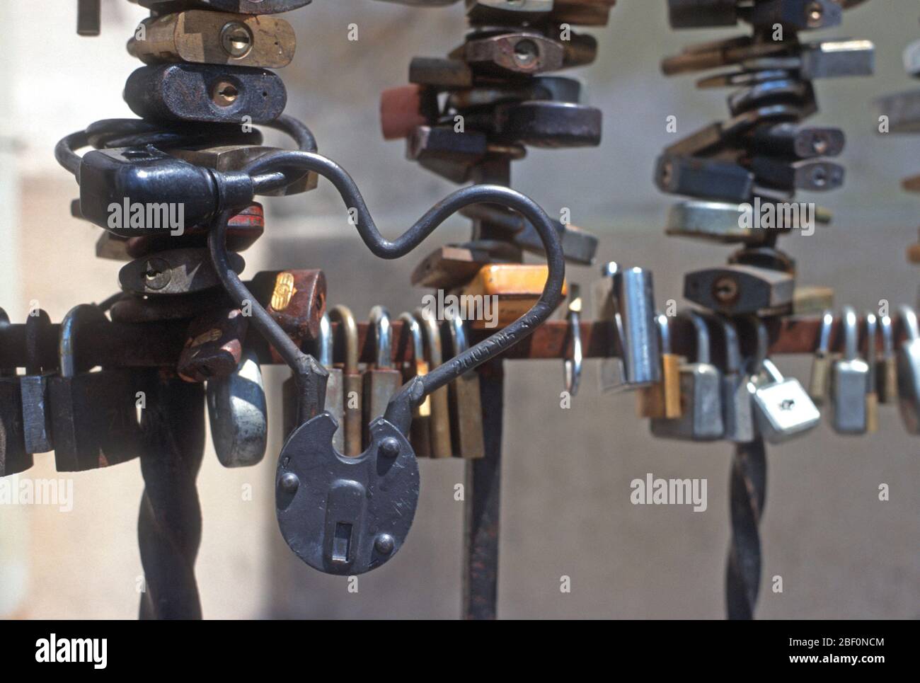 Locks on the railings of the bishop's palace in Pecs, Hungary, including a heart shaped one. Stock Photo