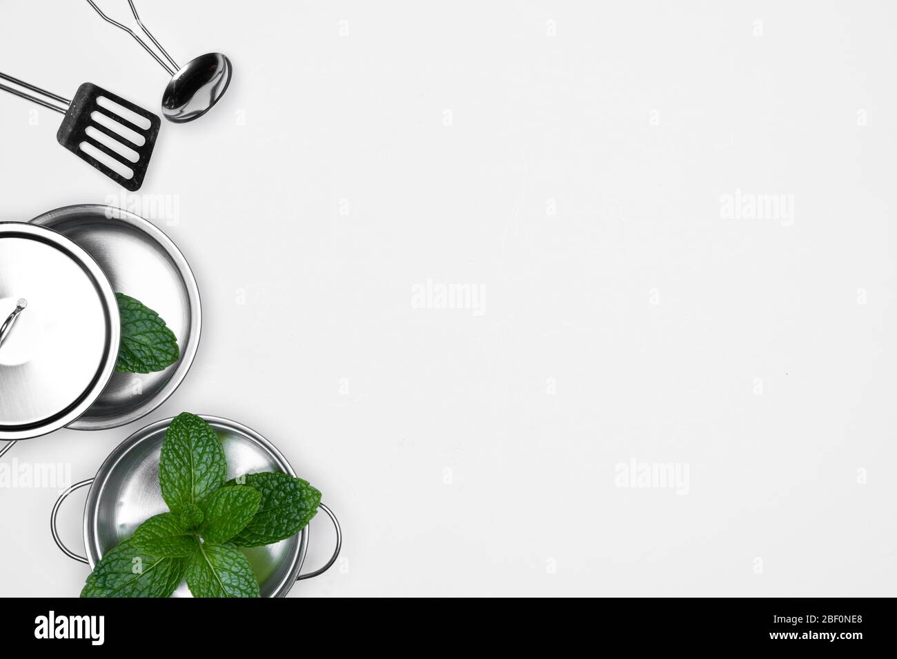 Kitchen Things Pan Bowl Ladles Pot With Fresh Herbs Mints On White Background For Copy Space Stock Photo Alamy