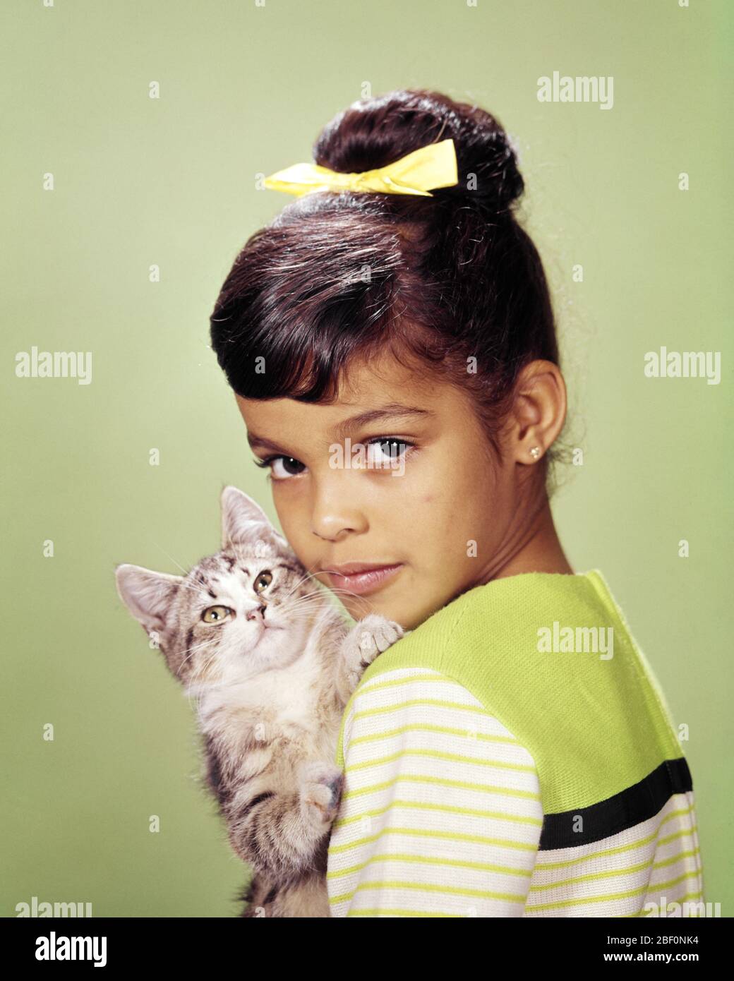 1960s 1970s CUTE YOUNG WIDE-EYED AFRICAN AMERICAN GIRL LOOKING AT CAMERA HOLDING HUGGING LOVING KITTEN - kc5151 PHT001 HARS HOME LIFE COPY SPACE FRIENDSHIP CARING PETS EXPRESSIONS EYE CONTACT MAMMALS HEAD AND SHOULDERS AFRICAN-AMERICANS AFRICAN-AMERICAN FELINE BLACK ETHNICITY FEELING LOVING CONNECTION FELINES PERSONAL ATTACHMENT WIDE-EYED AFFECTION COOPERATION EMOTION EMOTIONAL EMOTIONS JUVENILES KITTY MAMMAL TOGETHERNESS OLD FASHIONED AFRICAN AMERICANS Stock Photo