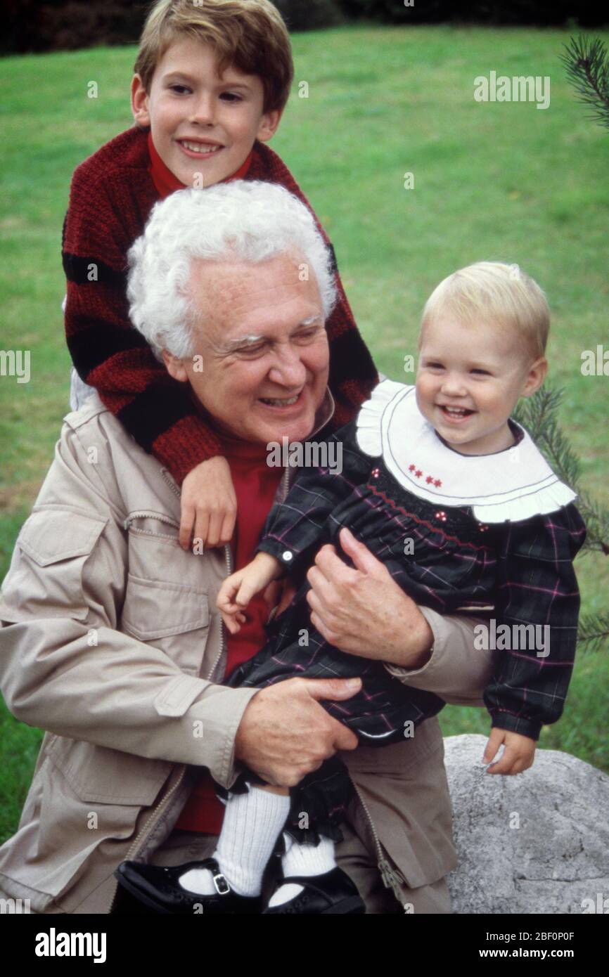 2000s 1990s GRANDFATHER HOLDING HUGGING PLAYING WITH TWO GRANDCHILDREN BOY AND GIRL OUTDOORS  - kj12409 PHT001 HARS SATISFACTION FEMALES GRANDPARENT HEALTHINESS HOME LIFE COPY SPACE FRIENDSHIP HALF-LENGTH PERSONS CARING MALES SENIOR MAN GRANDCHILDREN SENIOR ADULT HAPPINESS CHEERFUL HIGH ANGLE LEISURE EXCITEMENT PRIDE SMILES GRANDDAUGHTER GRANDFATHERS GRANDSON JOYFUL ELDERLY MAN PERSONAL ATTACHMENT AFFECTION COOPERATION EMOTION GROWTH JUVENILES TOGETHERNESS BABY GIRL CAUCASIAN ETHNICITY GRANDPA OLD FASHIONED Stock Photo
